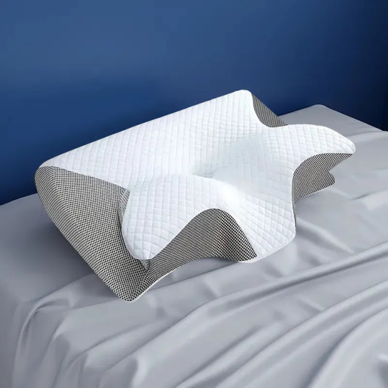 Oreiller a memoire de forme cervical gris clair - vue laterale mettant en valeur la forme ergonomique et les zones de soutien.