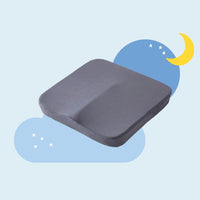 Coussin à mémoire de forme gris dans un fond bleu clair